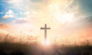 Good Friday concept: The cross on meadow autumn sunrise background clipart