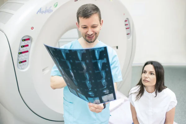 Consulting MRI of the leg with professional radiologist