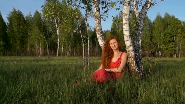 Singing Woman Sitting Near Trees — Stock Video