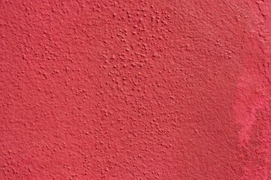 Kırmızı kabarık duvar sıva dokusu