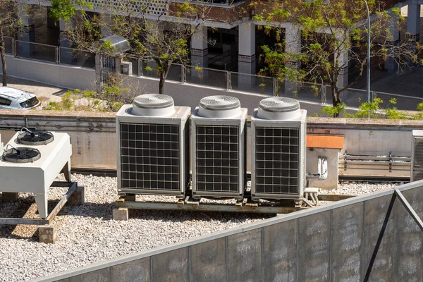 Industrial air conditioner units on a rooftop of a building. HVAC machines.