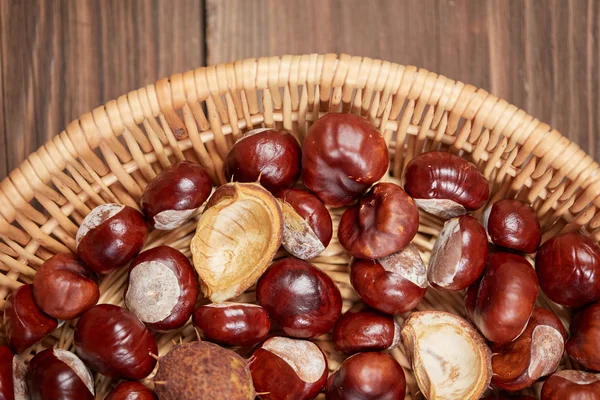 Chestnuts on a wooden table top view — Stock Photo, Image