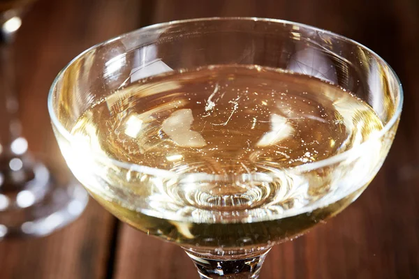 Closeup of glass of chmpagne on table — Stock Photo, Image