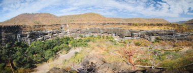 Panorama of touristic attraction Ajanta buddhist temples and caves in Deccan Plateau, Maharashtra state, India clipart
