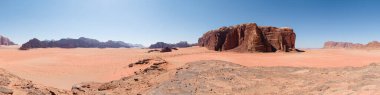 Panorama of a red desert landscape in Wadi Rum valley, Jordan, Middle East, famous hiking destination and set for movies The Martian and Lawrence of Arabia