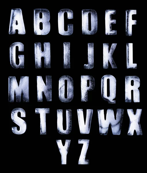 Frozen water in the shape of the alphabet isolated on black back — Stockfoto