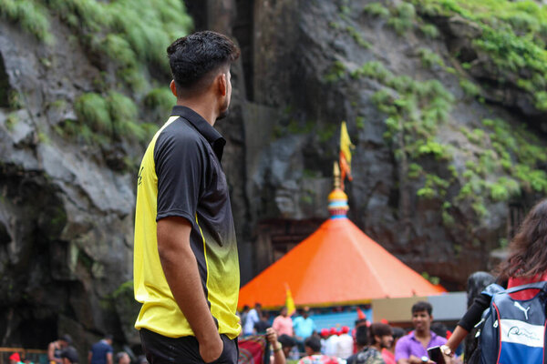 lonavala, Maharashtra / India - January 12, 2020:- Indian men looking at Shree Ekvira Aai Temple.