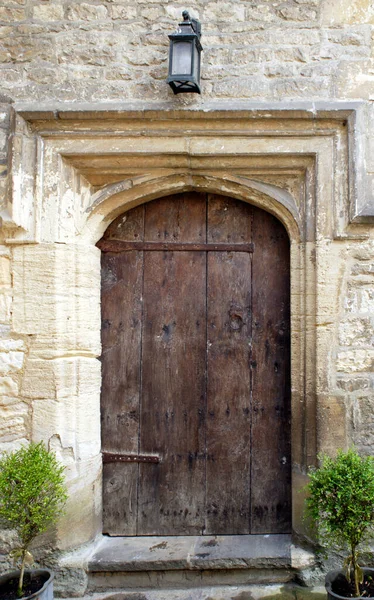 An ancient studded wood entrance door