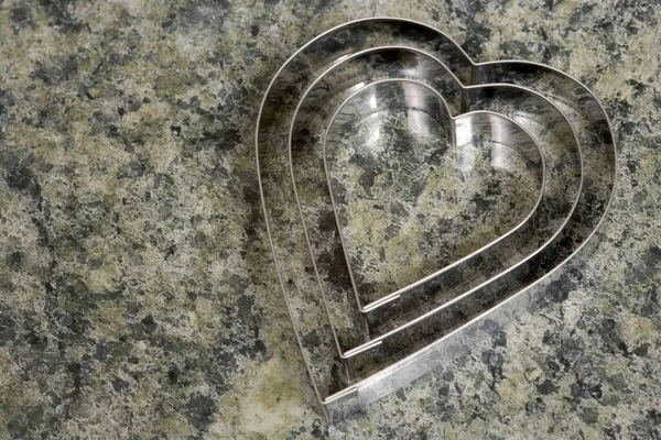 Set Three Heart Shaped Cookie Cutters Marble Effect Kitchen Surface — Stock Photo, Image