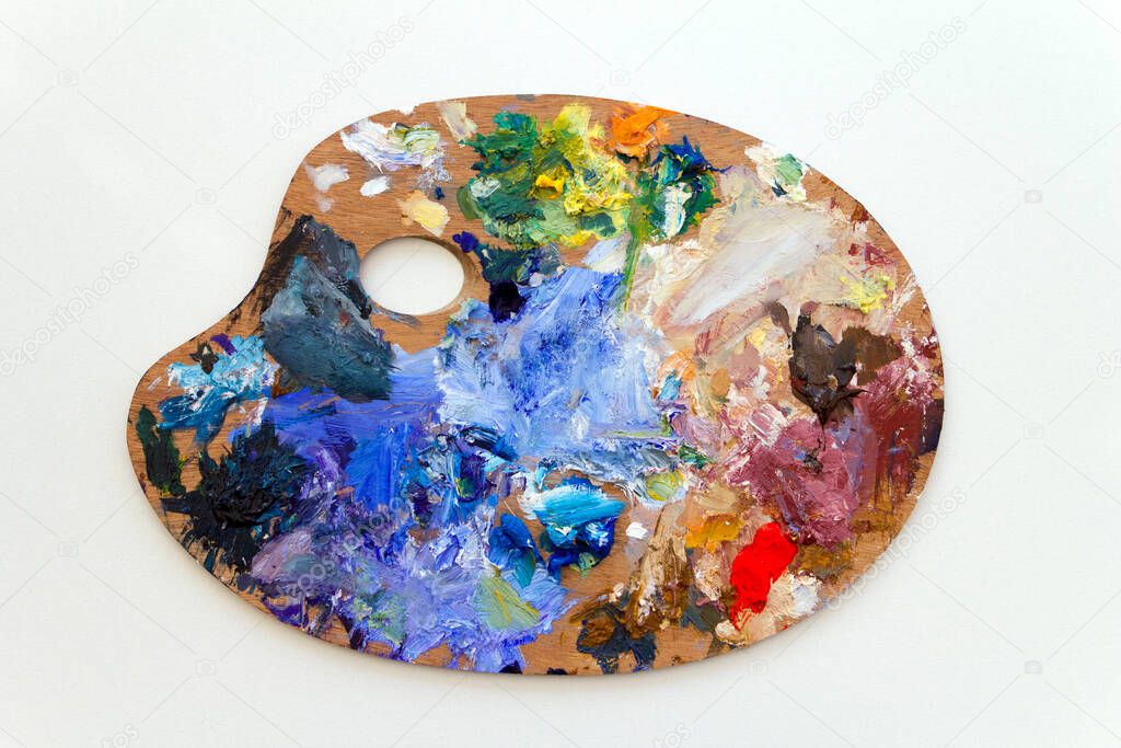 Vibrant multi-coloured artists oil paint palette