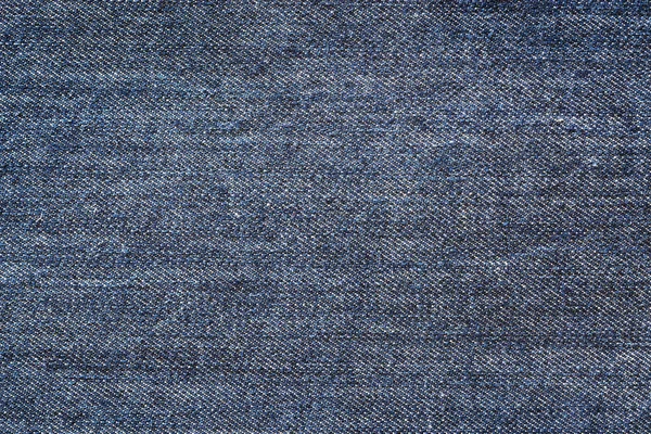 Tejido azul oscuro jeans textura fondo — Foto de Stock