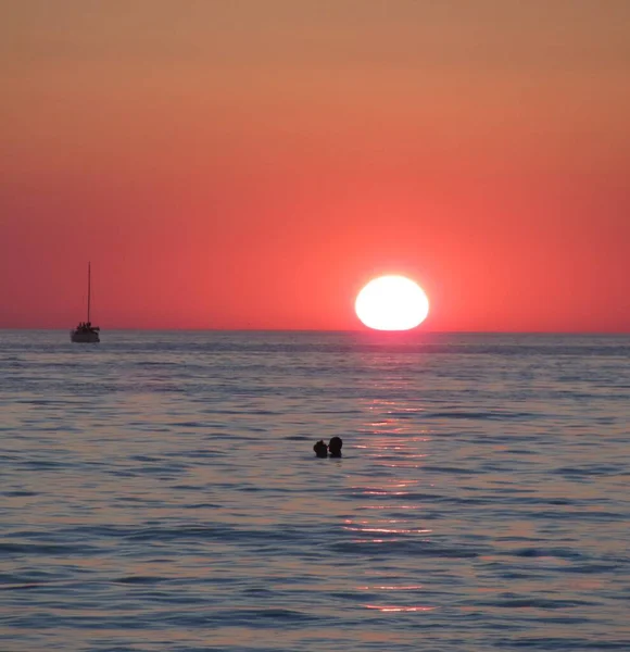 Sunset at sea. The sun on the horizon