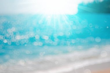 Tropikal plaj ile bokeh güneş ışık dalga arka plan bulanıklık.