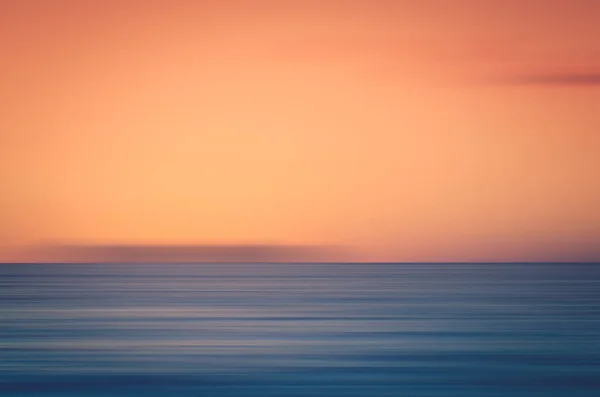 Θόλωση κίνησης τροπική παραλία ηλιοβασίλεμα με bokeh ήλιο κύμα φωτός αφηρημένα φόντο. — Φωτογραφία Αρχείου