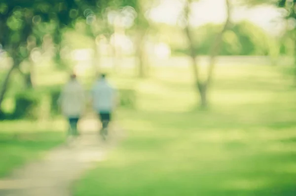 Blur nature green park with sun light copy space abstract background.