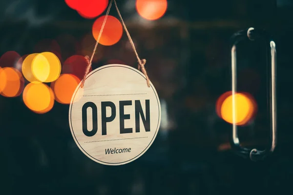 Open sign broad hanging on wood door front of cafe. — Stock Photo, Image