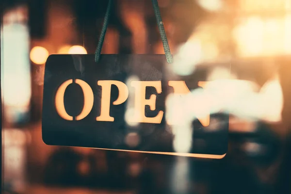 Open sign broad hanging on wood door front of cafe. — Stock Photo, Image
