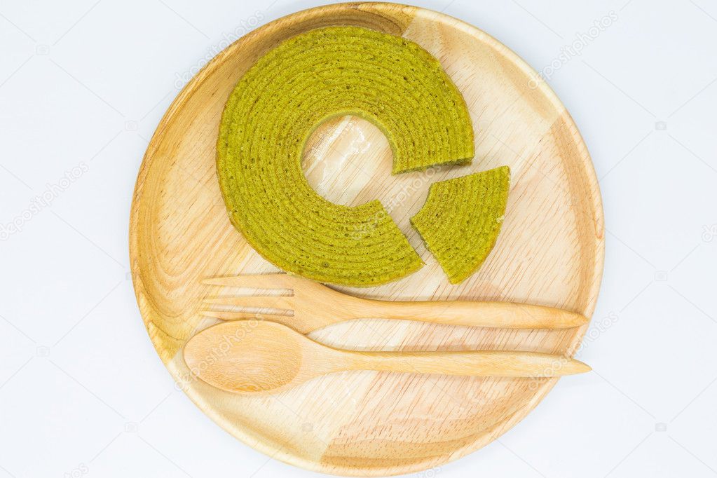 Multiple layer round green tea cake on wooden disk