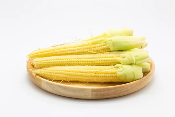 Baby corn on wooden plate — Stock Photo, Image