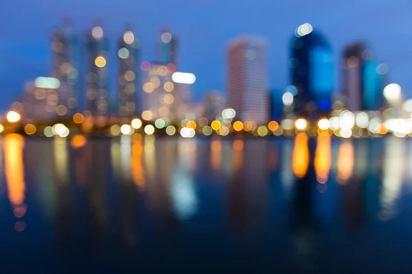 Twilight blurred lights city office building abstract background — Stock Photo, Image