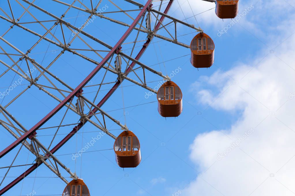Ferris wheel with blue sky background
