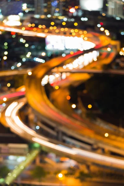 Luzes borradas do bokeh, perto da estrada trocada — Fotografia de Stock