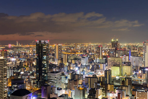 Osaka city business downtown at night view from Umeda sky building, Japan