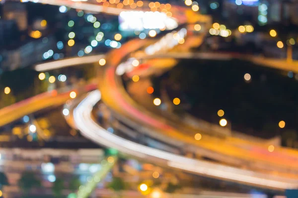 Blurred bokeh light highway intersection close up aerial view