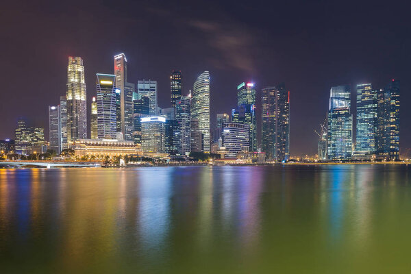 Singapore city central business downtown over Marina Bay, night view cityscape downtown