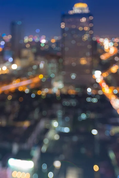 Noite luz da cidade turva bokeh centro da cidade — Fotografia de Stock