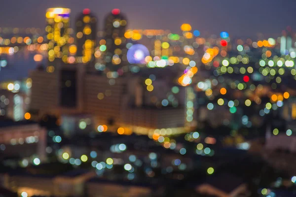 Night blurred bokeh city light aerial view — Stock Photo, Image