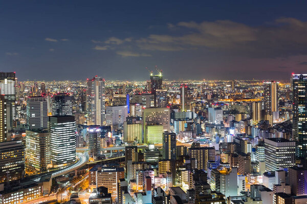 Osaka city downtown aerial view at night from Umeda Sky building
