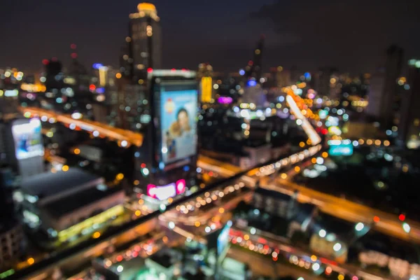 Top view city road interchanged and office building blurred bokeh light night view — Stock Photo, Image