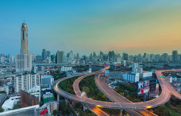 Aerial view, Bangkok city downtown and highway with blue twilight sky — Stock Photo, Image