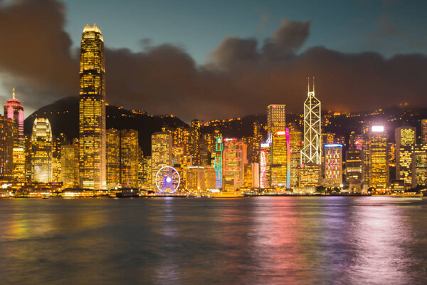 Night blurred bokeh light Hong Kong city downtown, abstract background