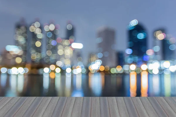 City blurred bokeh light office building with reflection at twilight — Stock Photo, Image