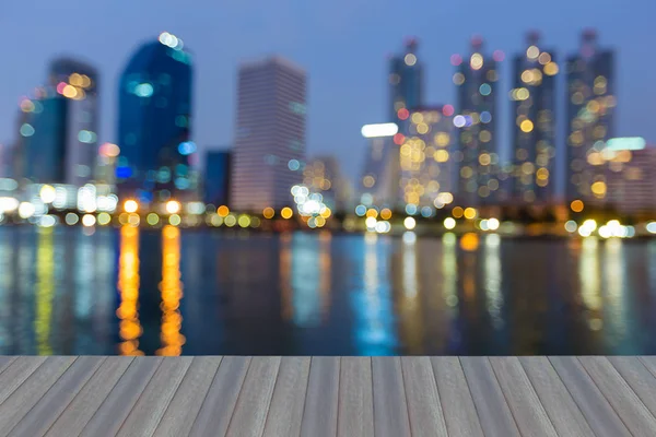 Twilight blurred bokeh office building with water reflection — Stock Photo, Image