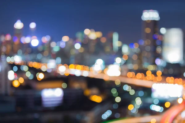 City blurred bokeh light and highway road — Stock Photo, Image