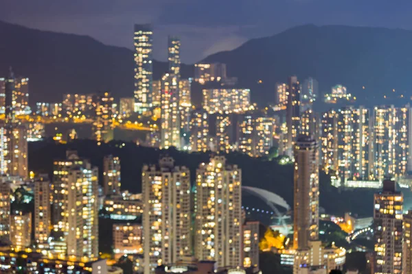 Night blurred residence apartment light on high hill, Hong Kong city