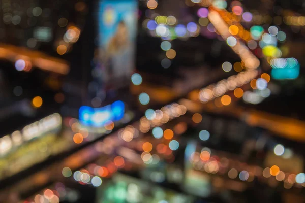 Vista aérea, bokeh embaçado luz cidade cruzamento visão noturna — Fotografia de Stock