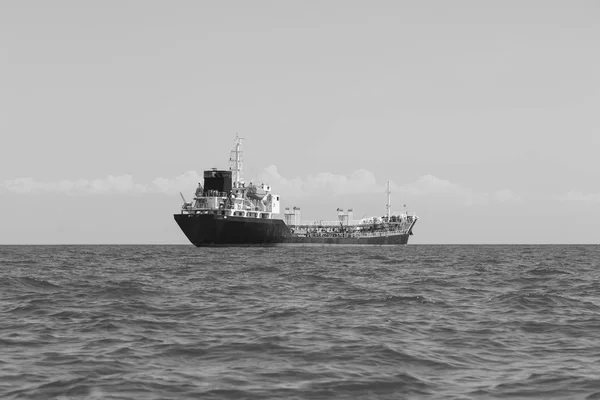 Oil transport tank ship over ocean skyline