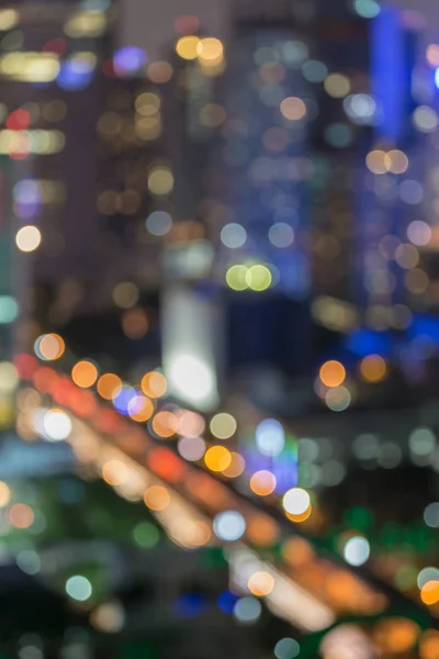 Aerial view blurred bokeh light city downtown — Stock Photo, Image