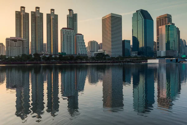 City office building with water reflection during sunset light — Stock Photo, Image