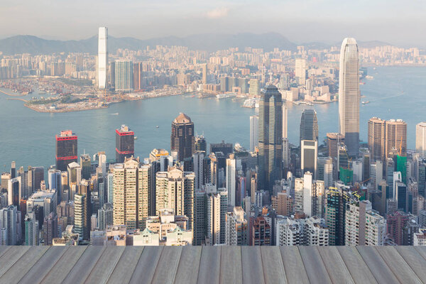 Opening wooden floor, Hong Kong central business downtown over Victoria Bay at The Peak point of view
