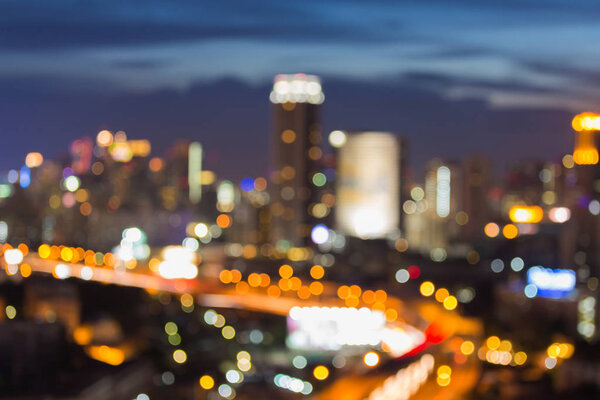 Night city central business downtown blurred bokeh light Bangkok Thailand, abstract background