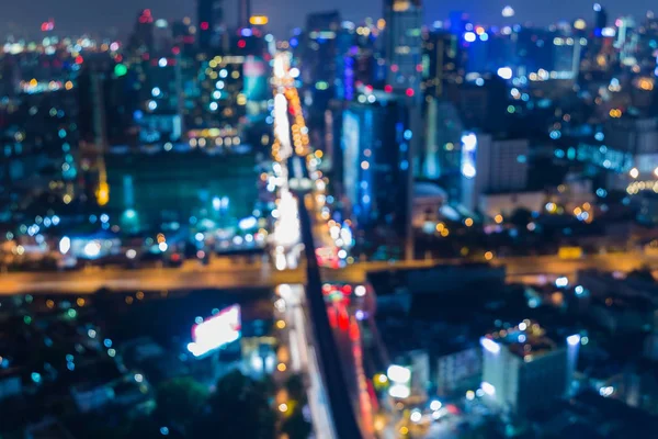 Night blurred bokeh city light downtown and road intersection — Stock Photo, Image