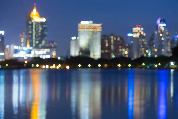 Night reflection blurred bokeh office building light at twilight — Stock Photo, Image