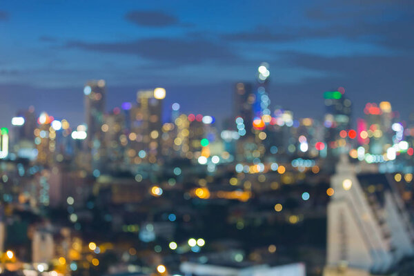 City night blurred bokeh light office building, abstract background