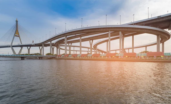 River front over highway intersection with suspension bridge — Stock Photo, Image