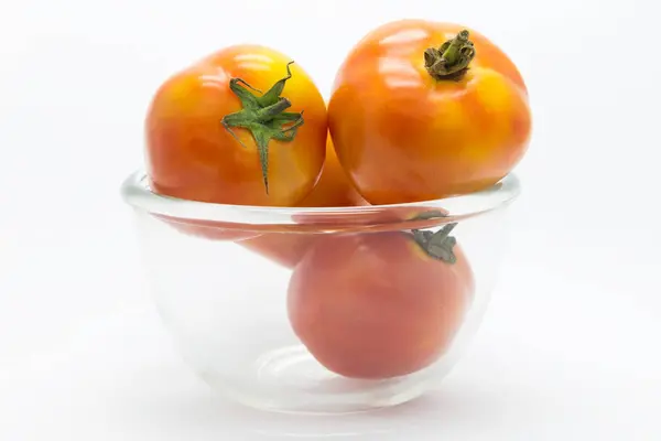 Fresh tomato on glass cup — Stock Photo, Image